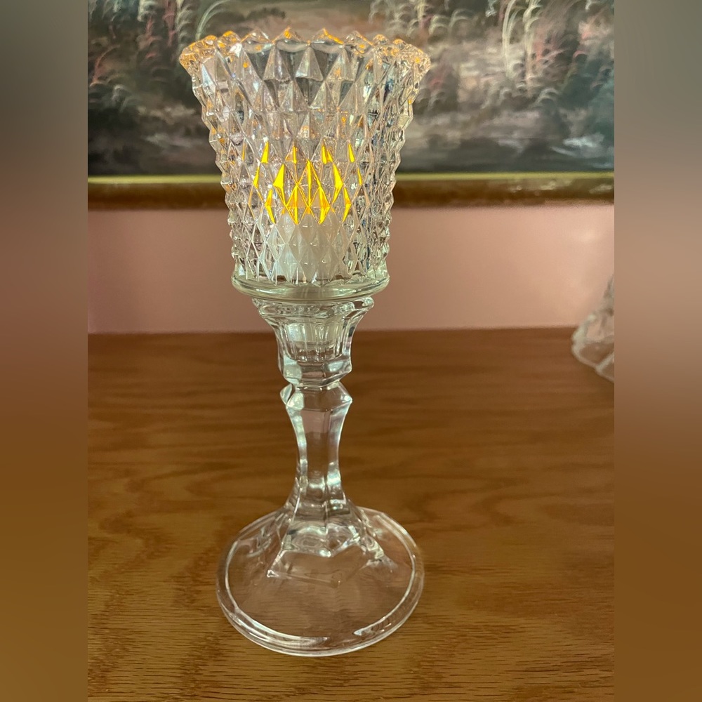 Diamond cut peg votive with base.